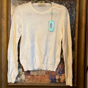 See By Chloe sweater.  It has a scull design and perfect for spring. Brand new.
